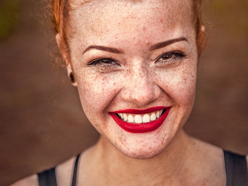 woman smiling after dental procedure at vitalize